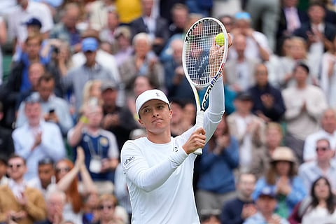 Iga Swiatek reacts after defeating Petra Martic